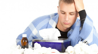 Young man sick with FLU