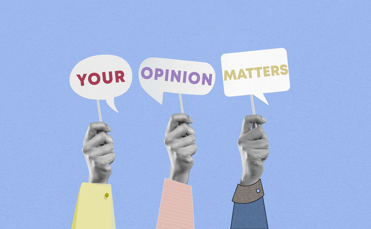 Group of paper hands showing your opinion matters words on speech bubble cards on blue background